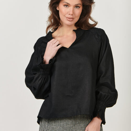 GA499 Black You won’t go unnoticed with GA499, a long-sleeve linen top with a split-crew-V-neck and luxurious balloon sleeve. Fine layers of gathering and stitching detail at the shoulders create shape and texture, while gathering at the sleeve cuff gives the effect of a ruffled cuff. Made from 100% linen, designed to be worn tucked in or loose. The model is 169cm tall and wears a size S equivalent to a size 10