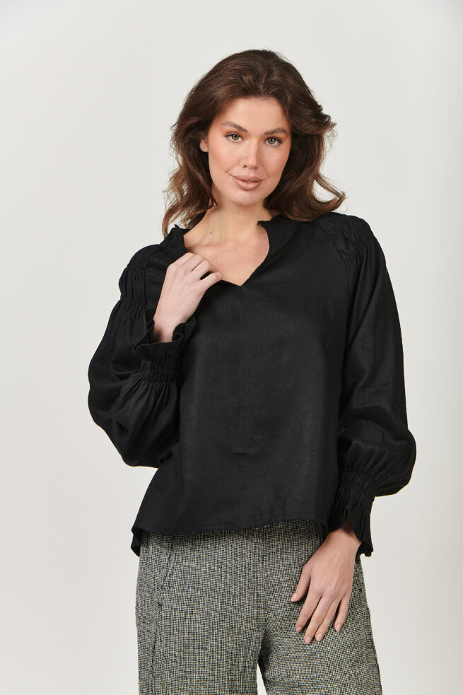 GA499 Black You won’t go unnoticed with GA499, a long-sleeve linen top with a split-crew-V-neck and luxurious balloon sleeve. Fine layers of gathering and stitching detail at the shoulders create shape and texture, while gathering at the sleeve cuff gives the effect of a ruffled cuff. Made from 100% linen, designed to be worn tucked in or loose. The model is 169cm tall and wears a size S equivalent to a size 10